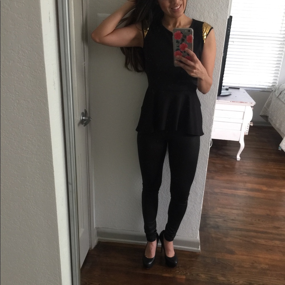 Black peplum top with gold detail